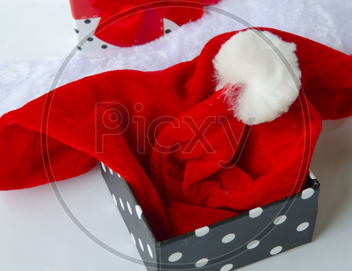 Present for Christmas With Santa Cap or hat in gift Box