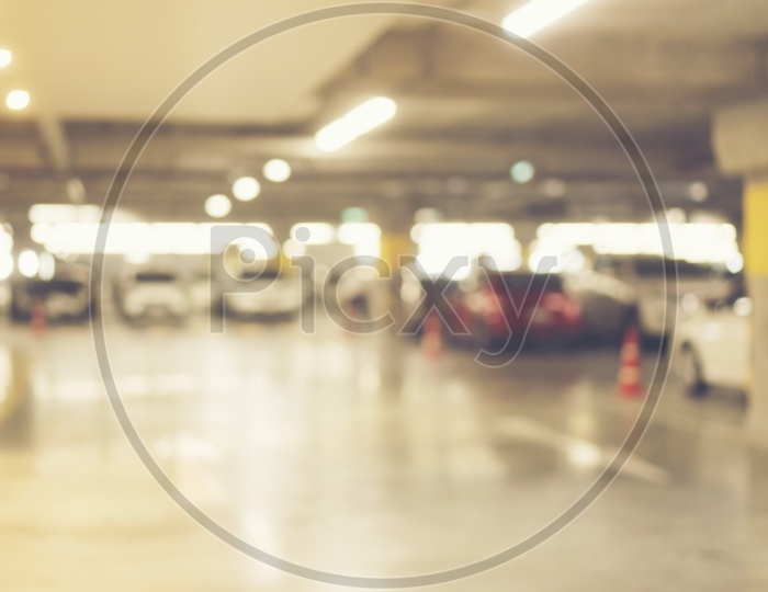 Abstract Image With Cars In a Parking Lot Blur Or Bokeh Background
