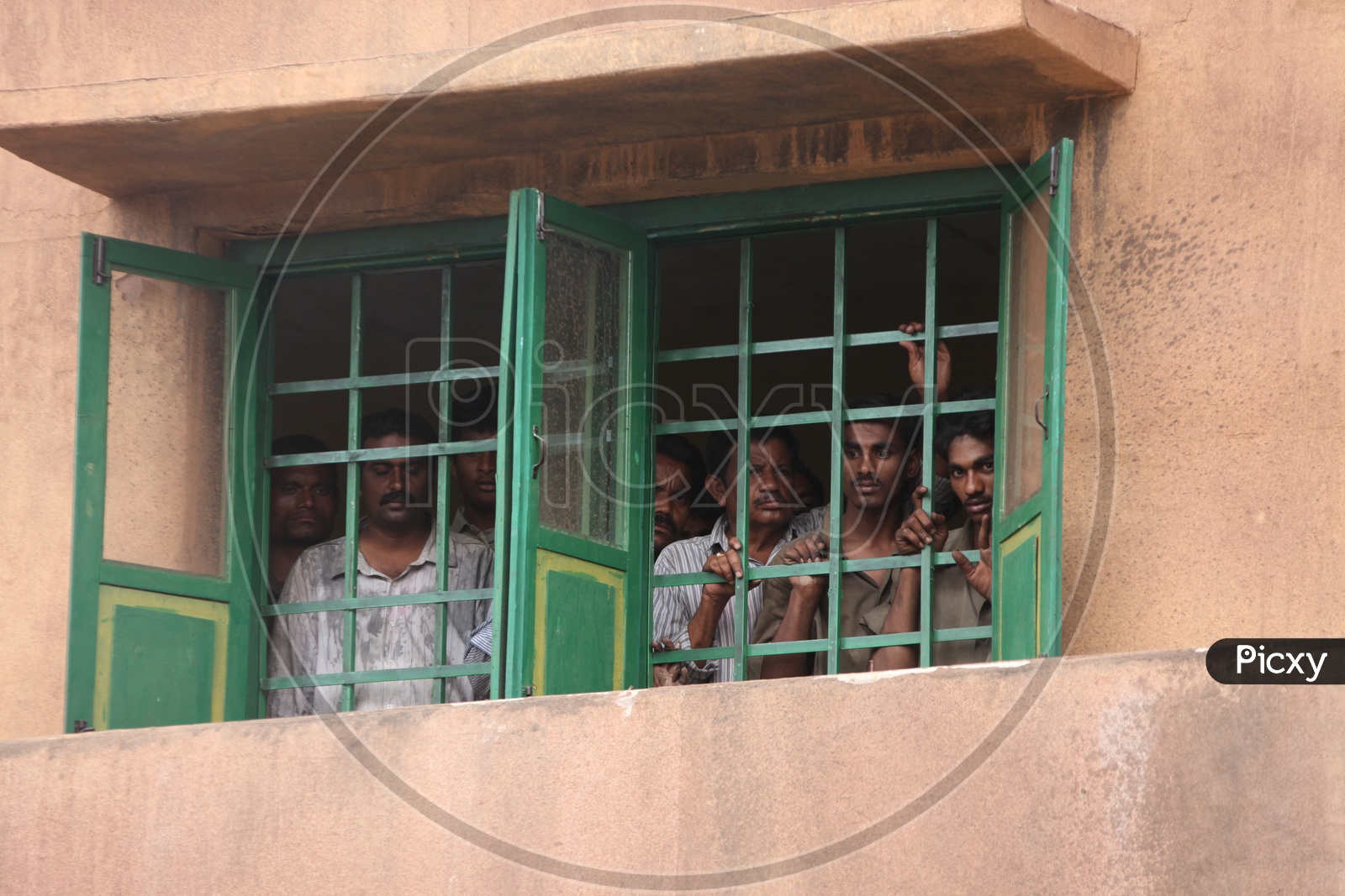 Indian Men peeping through the windows