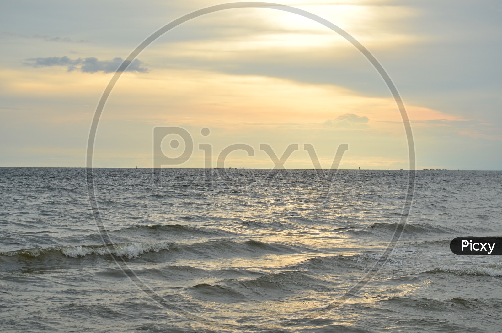 Beautiful Sunset Over Sea Water With Golden Hour Sky In background