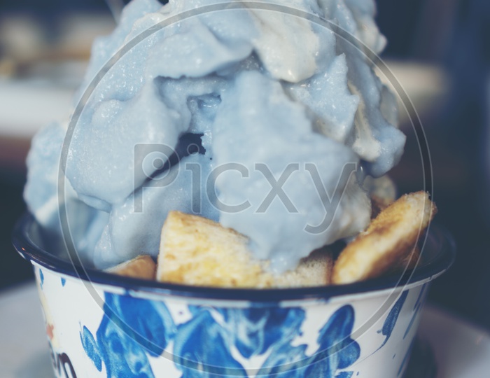blue ice-cream with herbs in  a Bowl