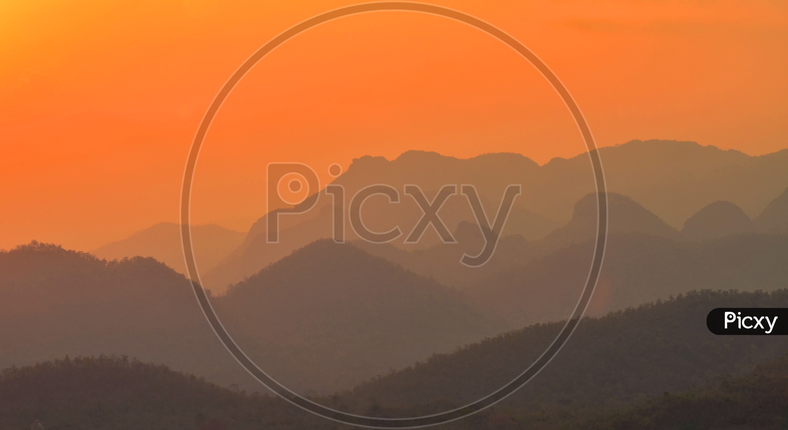 Mountains With Sunset Sky in background
