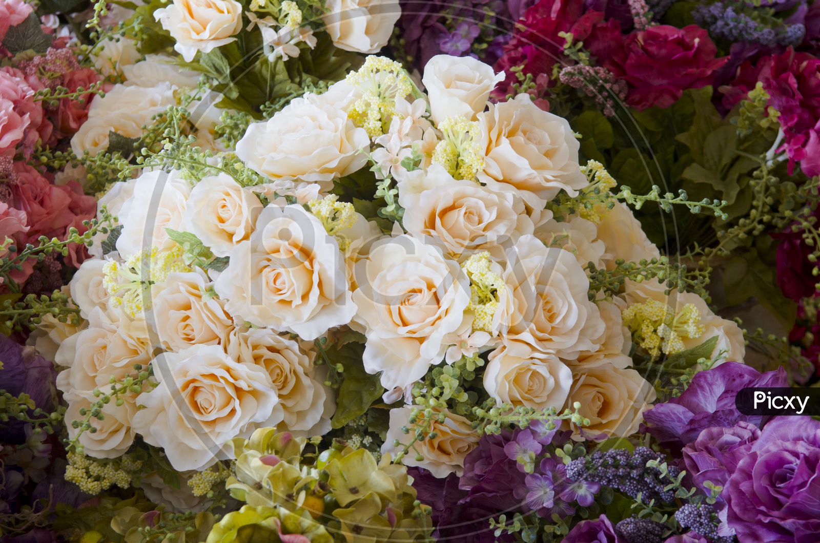 wedding bouquet with White  rose bush Ranunculus asiaticus as a background