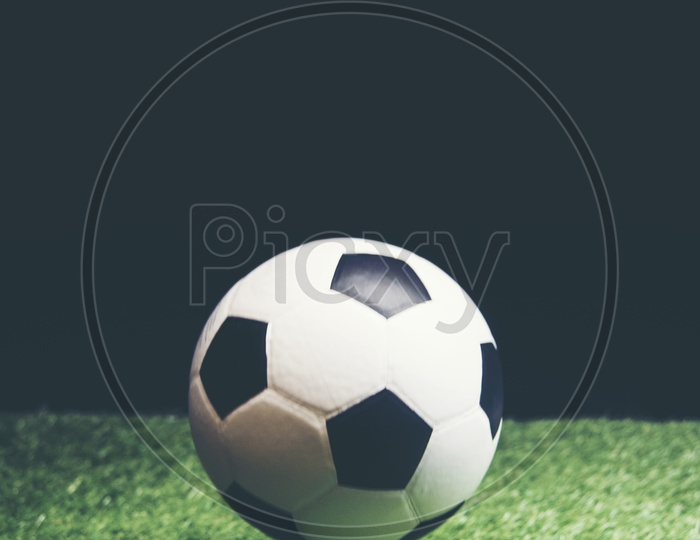 Bouncing Soccer ball on grass