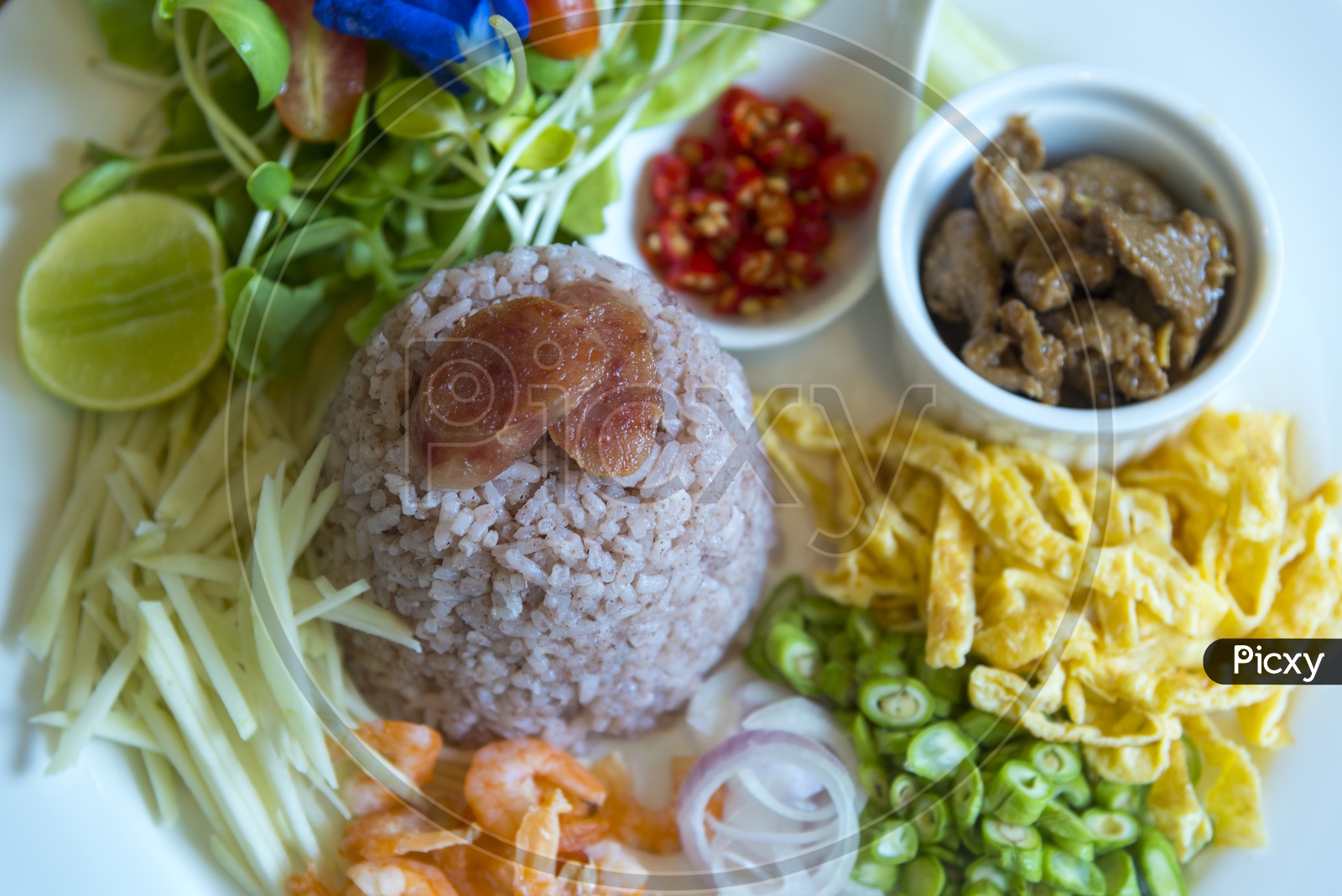 Thai Food, Rice Platter  With Pork, Shrimp or Prawn and Veggies Served Closeup