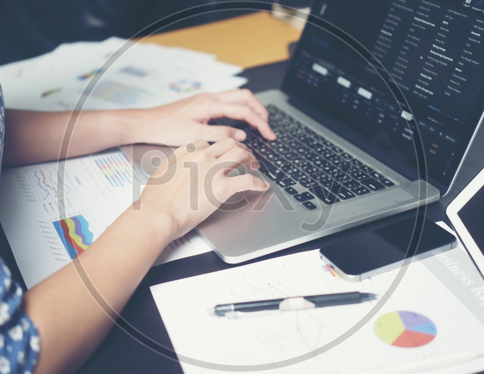 Business Woman Working With Laptop  On Office Desk Hand Closeup