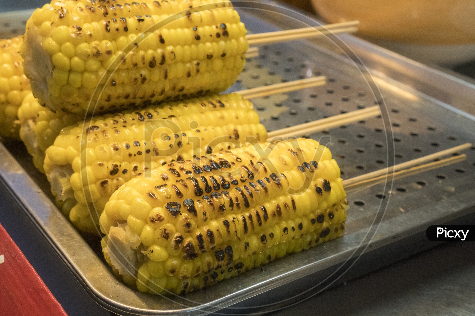 Sweet corn Grilled In a Street Food Vendor stall