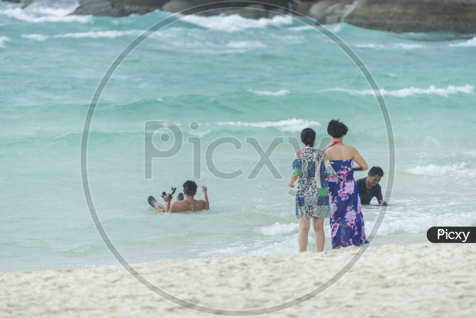 Tourists Enjoying Swimming At Phuket Beach