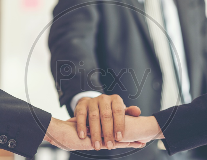 Startup Business Entrepreneurs Joining Hands In a Business Meeting Hands Closeup