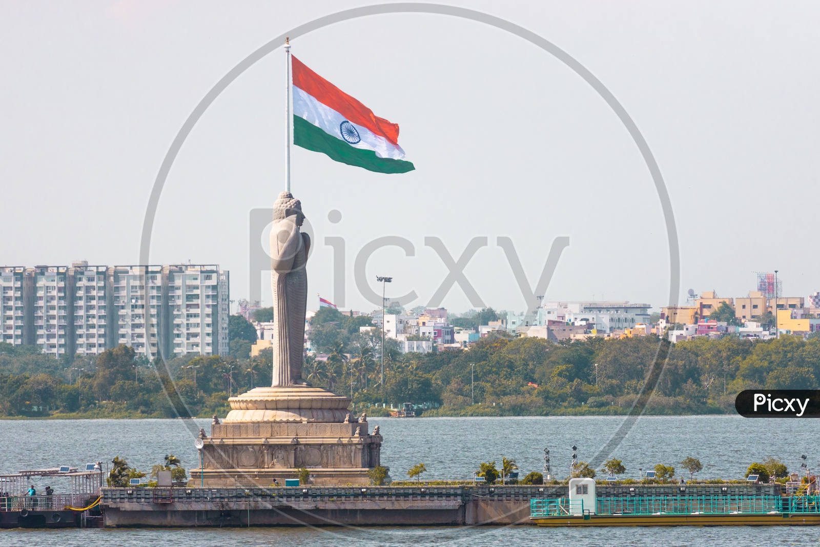 Monolith Of  Gautama Buddha Statue With Indian Flag in Background