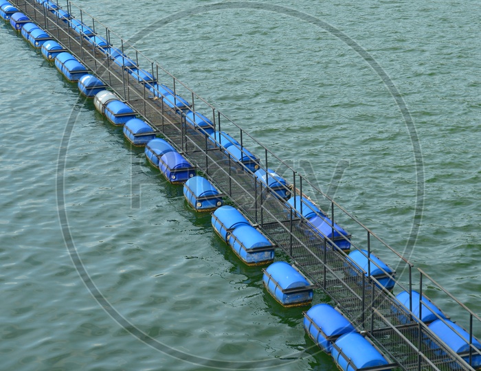 Buoy Lines  made of plastic drums floating on water in Hydroelectric Power plant of dam