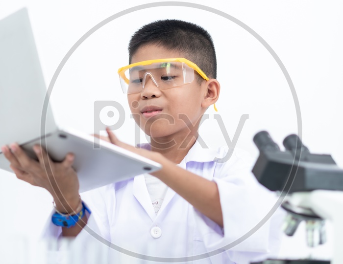 Curious Boy in a Laboratory Learning in Laptop