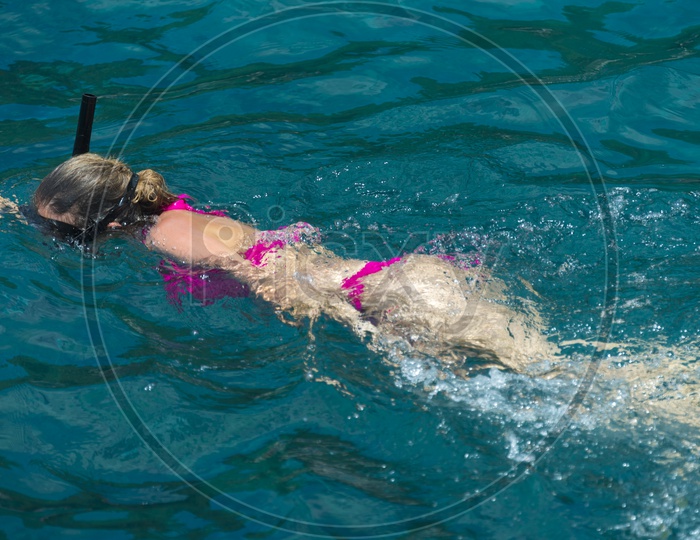 A Tourist Swimming In Sea Wearing Bikini At Phuket beach