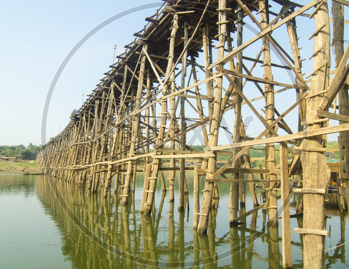 Structure Of wooden Bridge With Wooden Logs