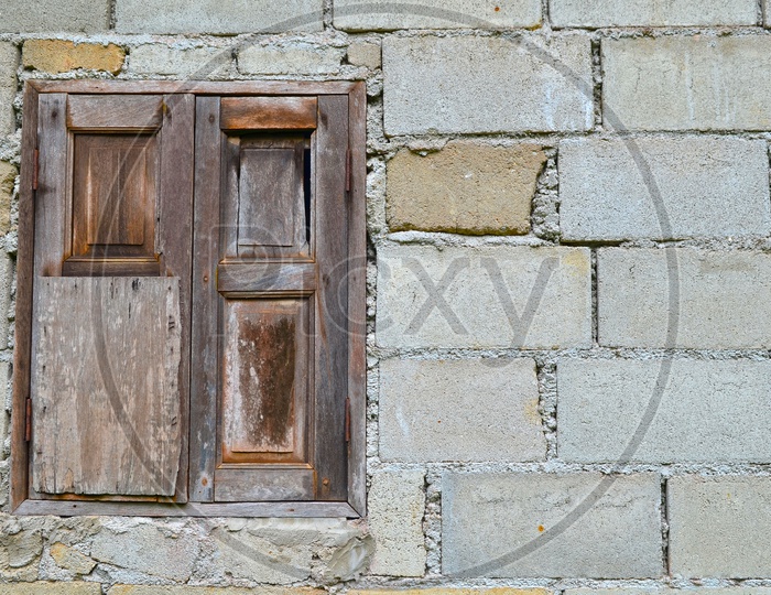 Old Brick Wall With traditional Wooden Window Forming a background