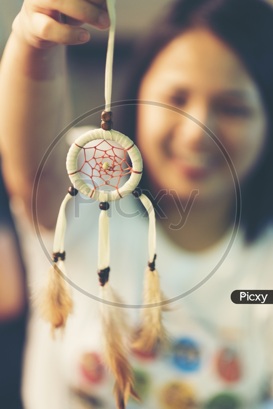 Dream catcher With Woman Bokeh In Background