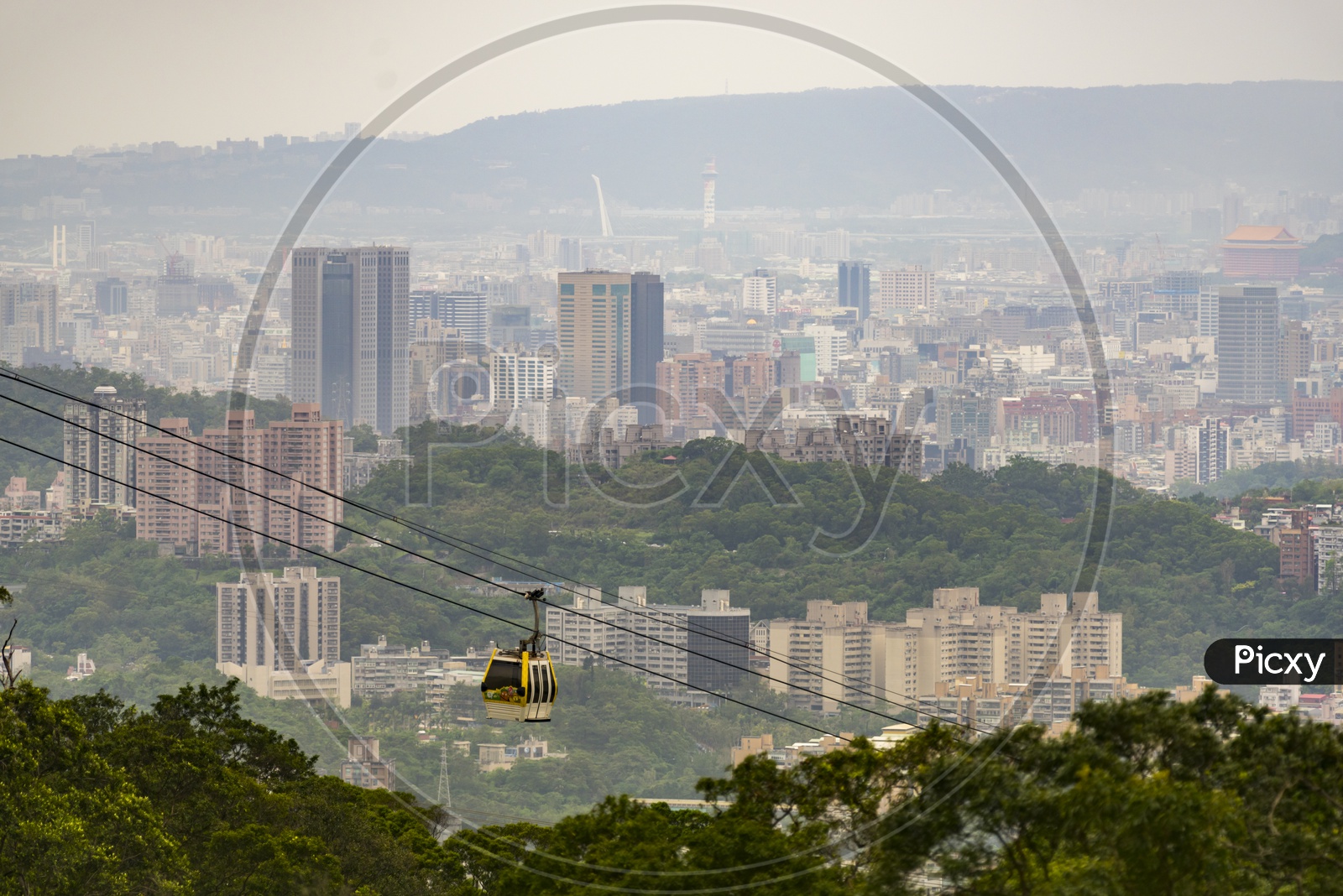 Rope Way or Cable Way With Cabin Cars With a View of City Scape