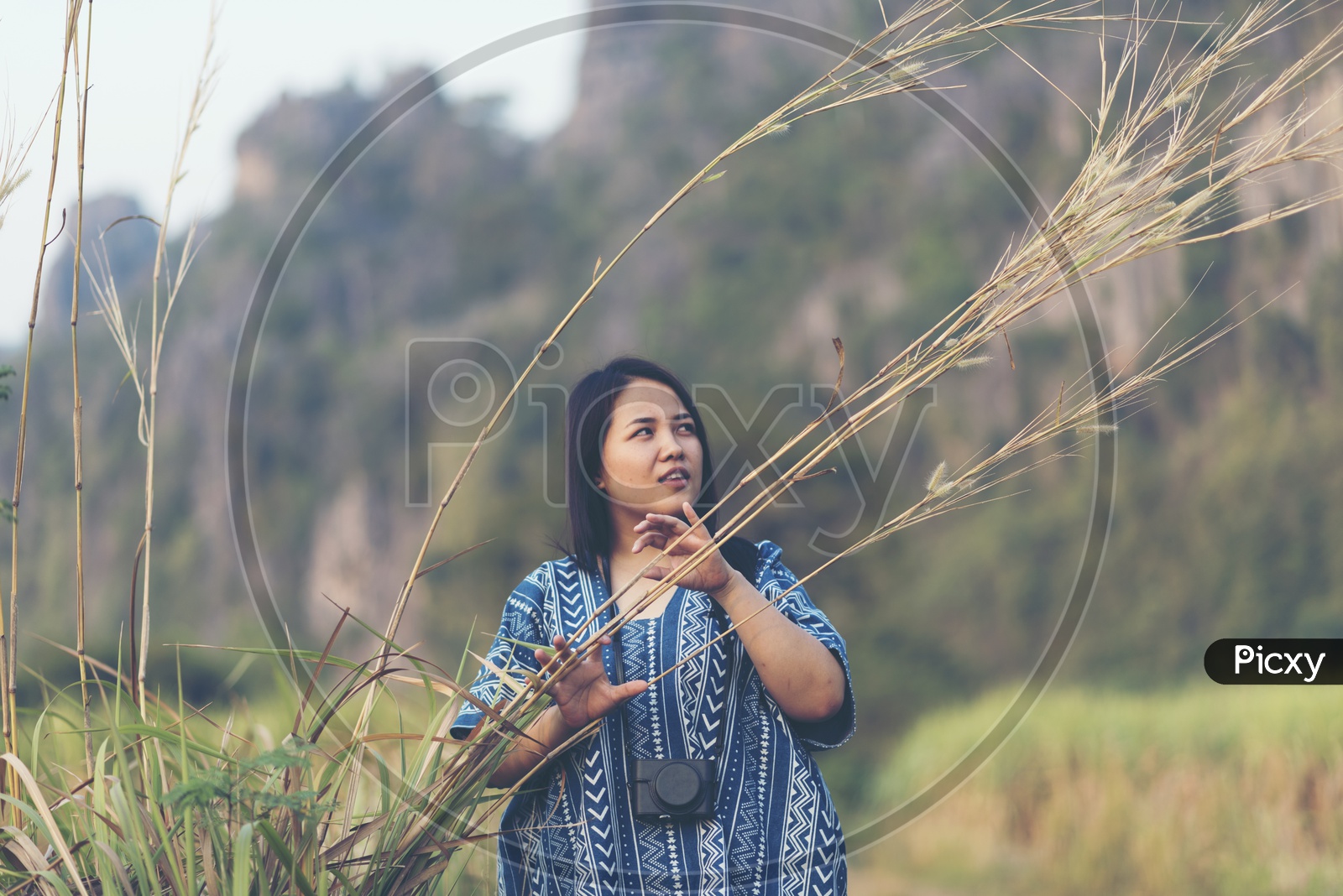 A Woman Photographer in Nature Background
