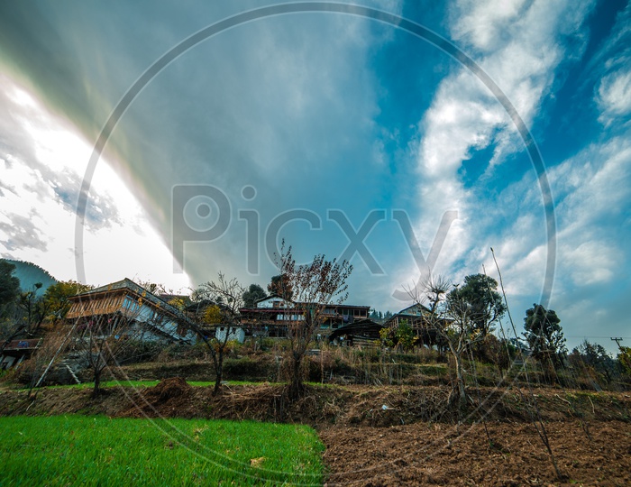 Agricultural Fields in The Villages Of Himalayan Mountains  With  Blue Sky in Background