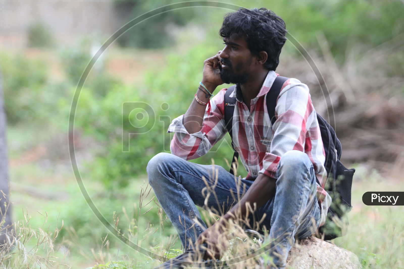 Indian Young Man talking over the phone