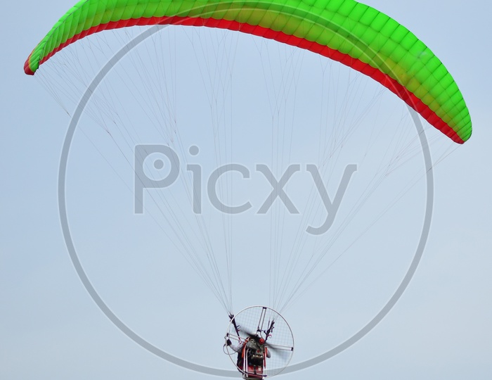 paraglider Flying In Sky