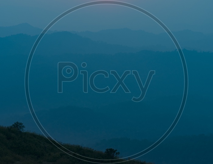 Sunset Over Mountain Layers Background In Khao Yai National Park , Thailand