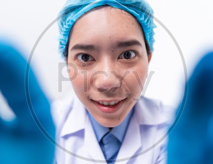A young scientist with hair mask in the laboratory