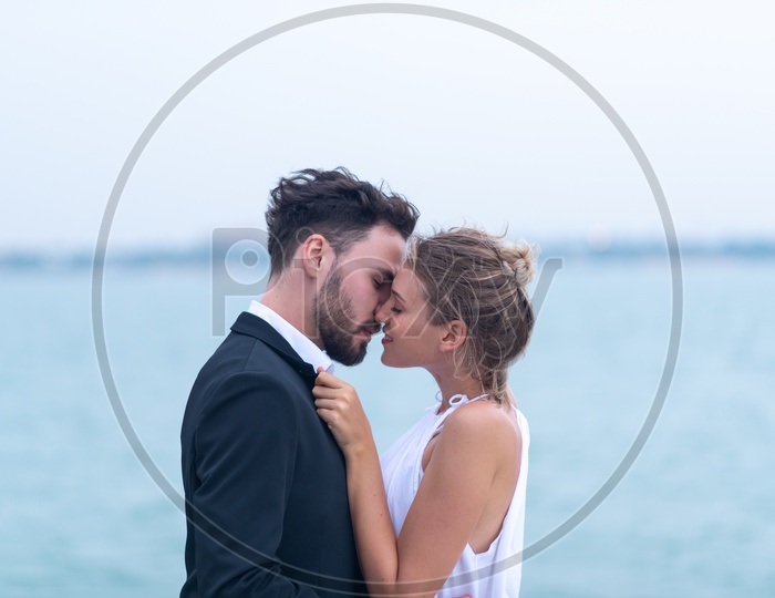 Young Couple Kissing on Yacht