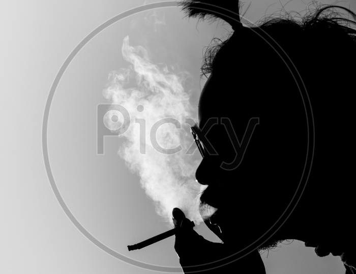 silhouette of a smoking man