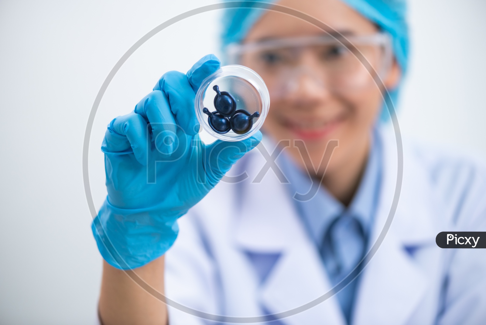 Young Asian Woman Scientist Holding Pill or Capsule in Hand, Healthy Nutrition