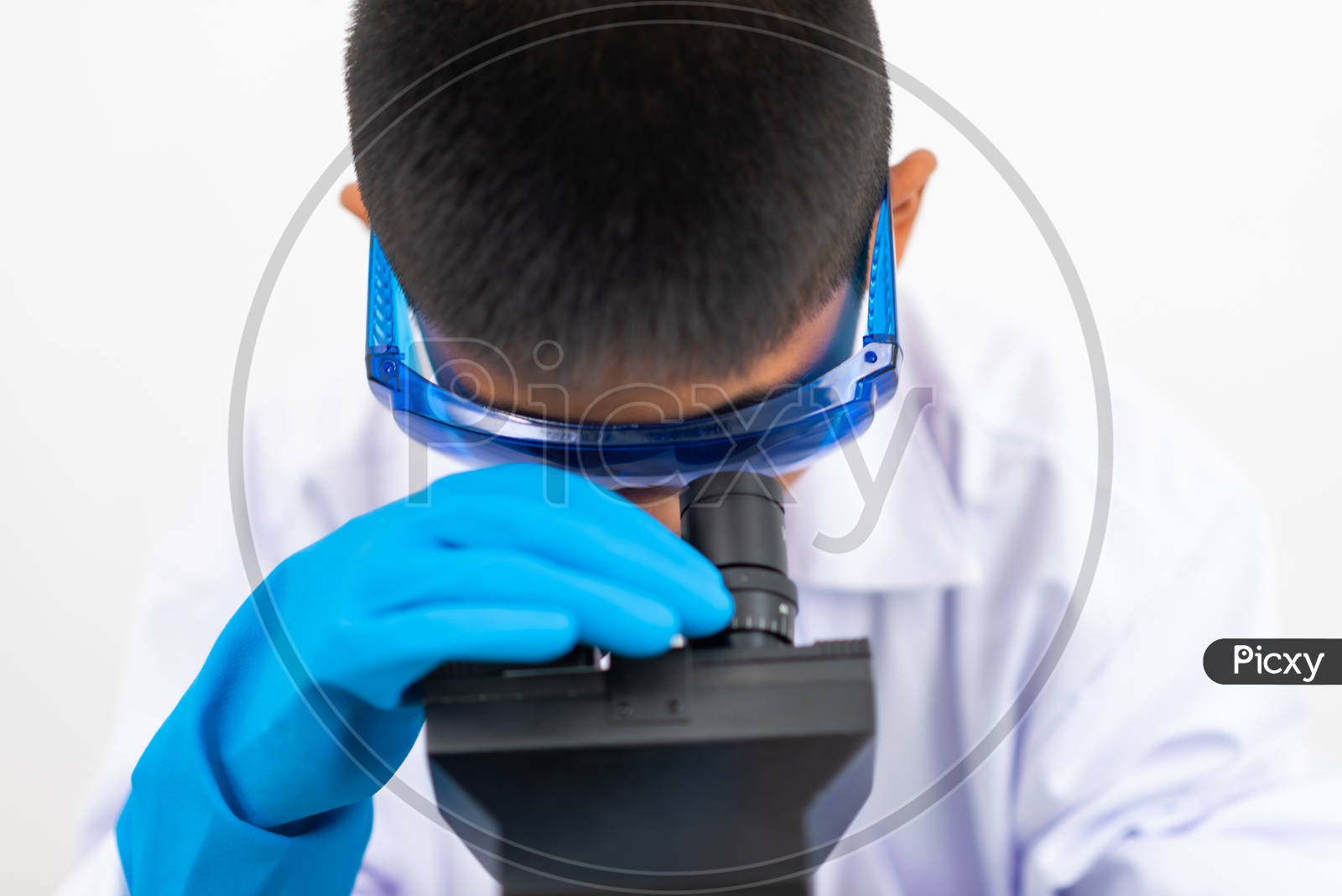 Asian Child Scientist Looking on Microscope in Laboratory