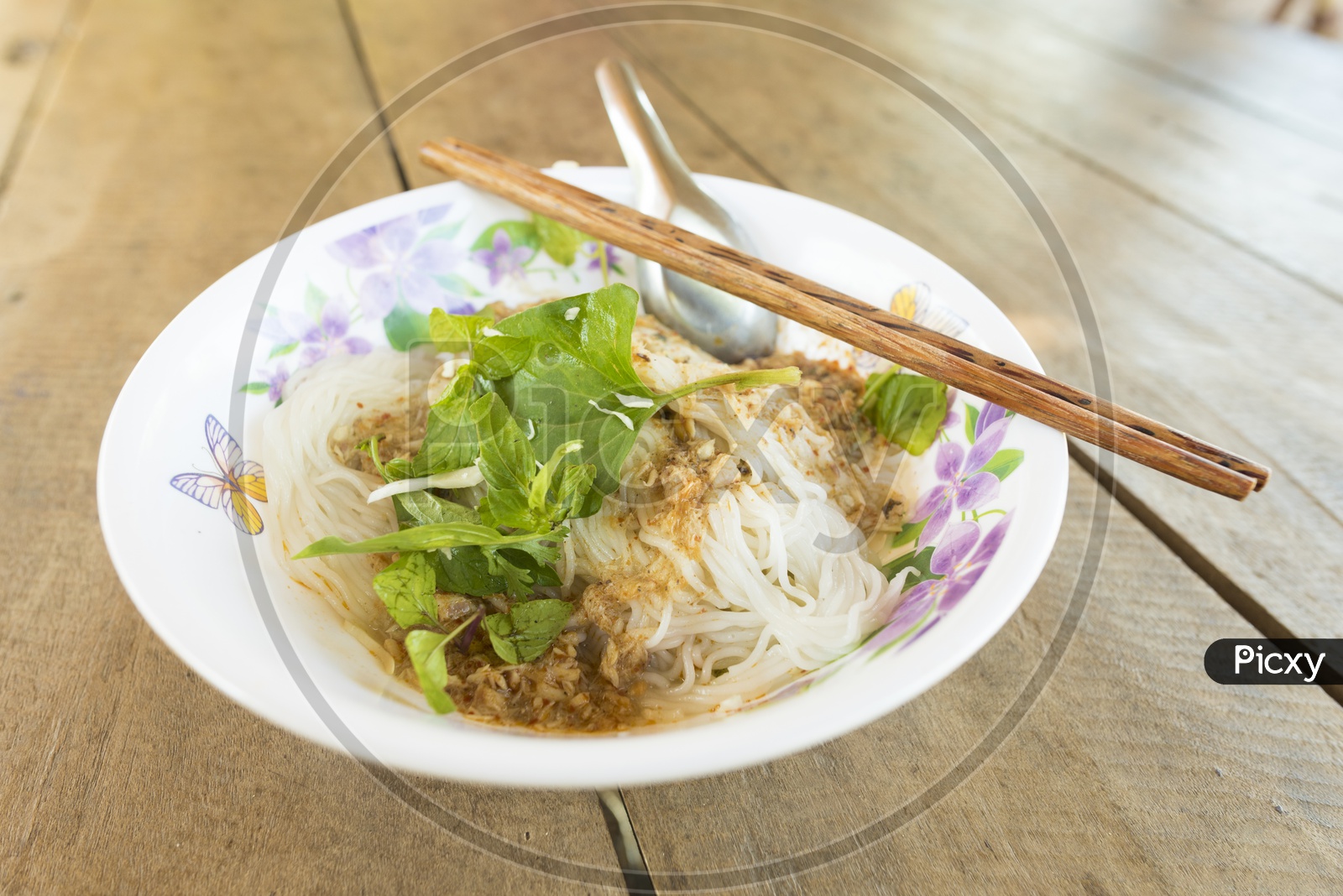 Noodles in a Plate on Wooden Table