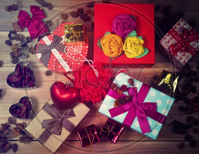 Artistic Templates For Valntine's Day Or Lovers Day With Flowers,red Love heart And Gifts On Wooden Background