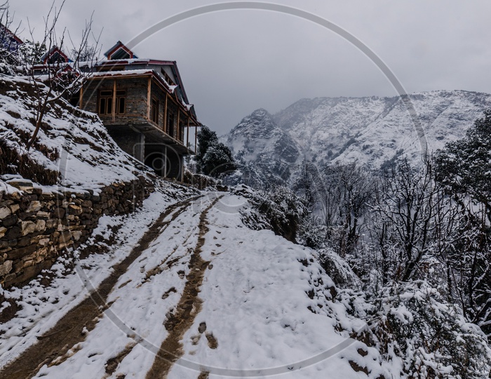 Snow covered wooden house in himalayas in winter Season