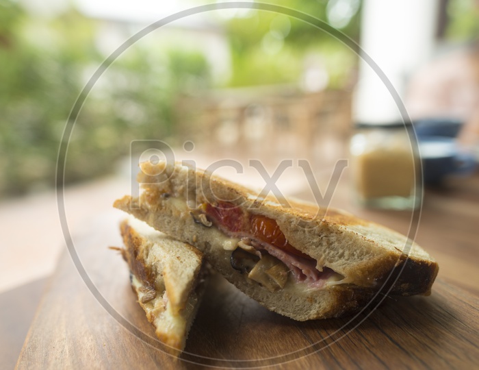 Sandwich slice on a wooden table - morning breakfast