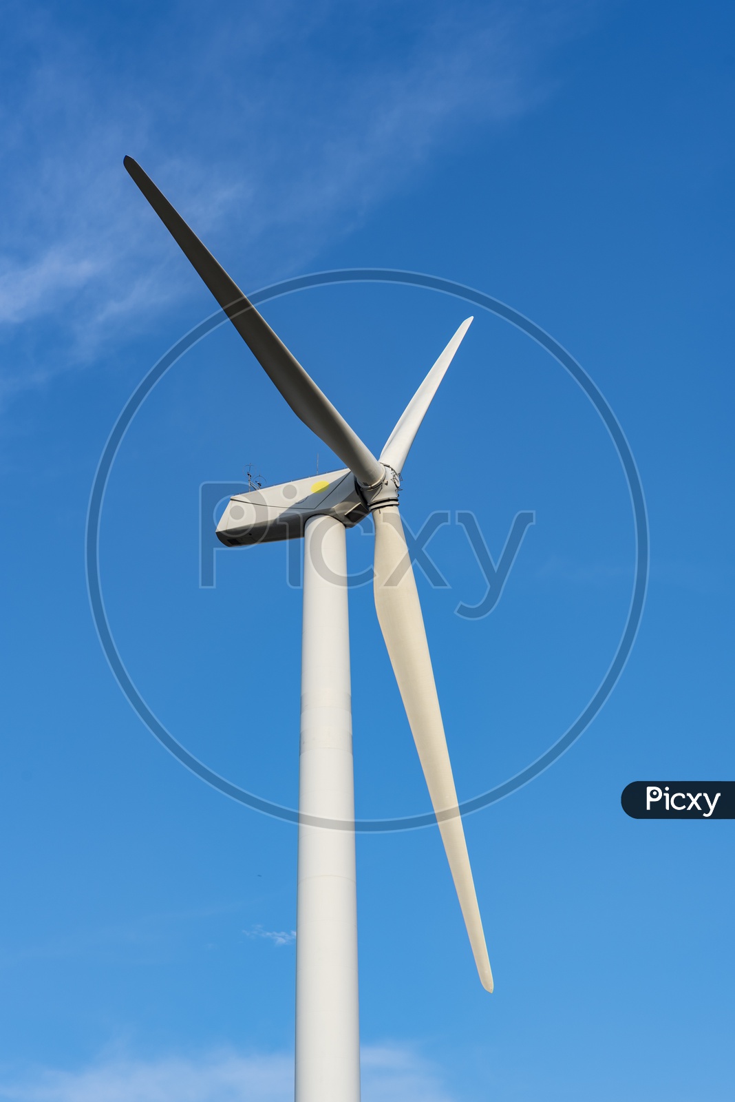 Wind Turbine with Blue Sky in Background, Renewable Energy Concept
