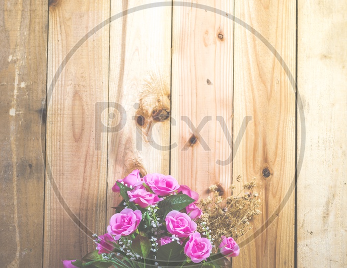 Rose Flowers Bouquet Over Wooden Background With Vintage Filter