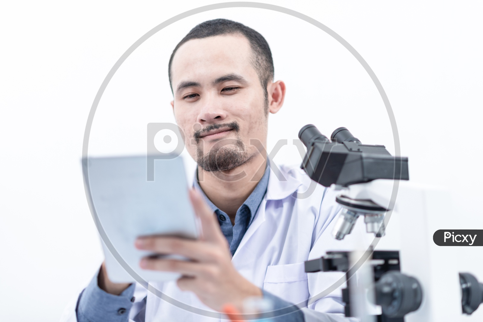Young Asian Scientist or Medical Student working with digital tablet in laboratory