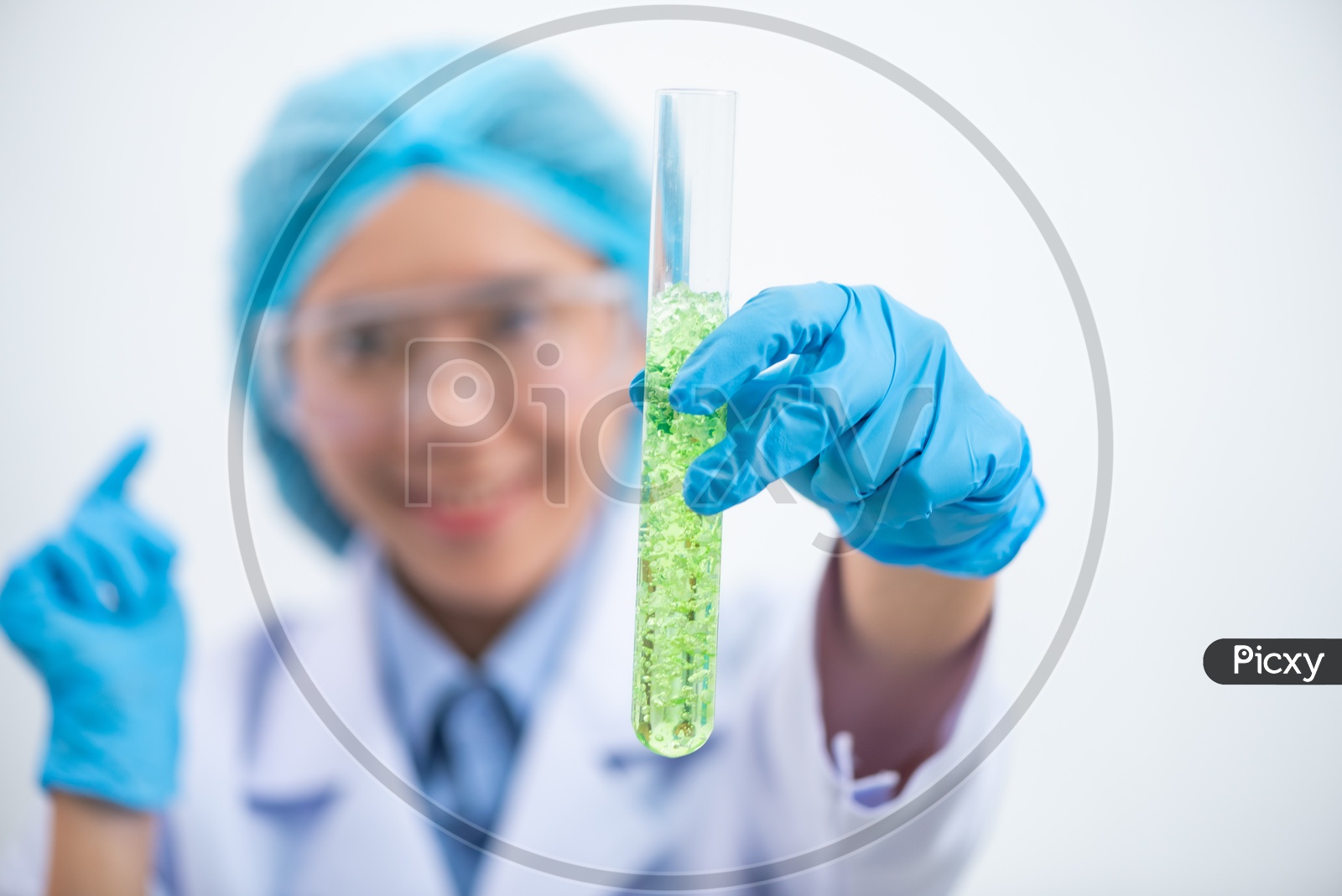 Young Asian Woman Scientist Holding Leaf in Test Tube at Laboratory, Bio Fuel