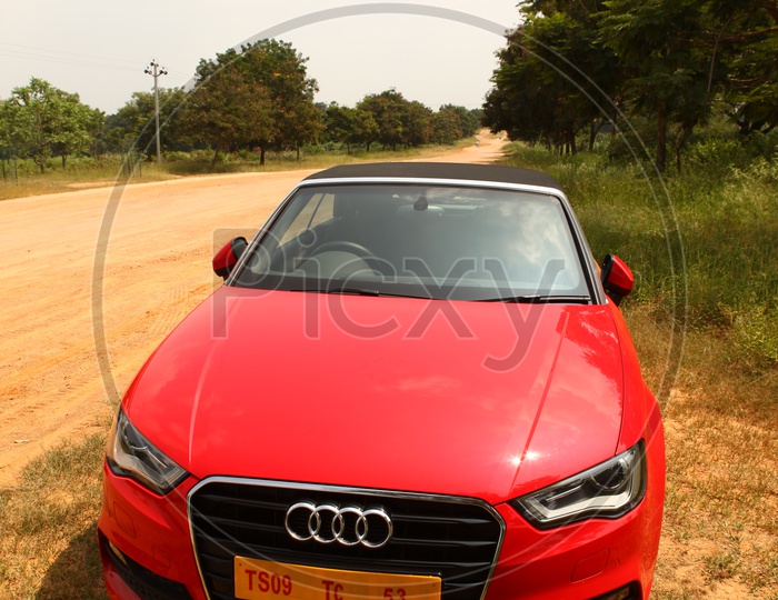 Red Color Audi A3 Cabriolet Car on Country Road