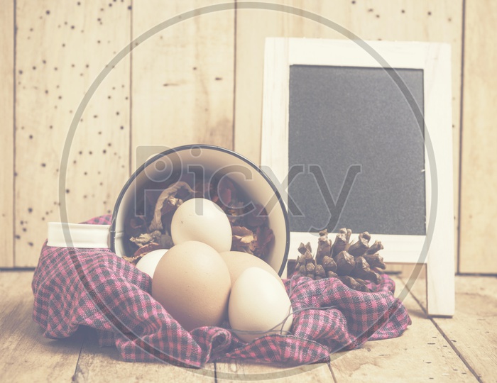 Easter festival creative Backgrounds With Easter Eggs over Wooden background And Vintage Filter
