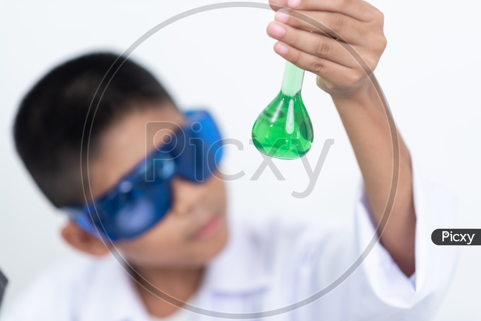 Asian Child Scientist Holding a Solution in Test Tube at Laboratory
