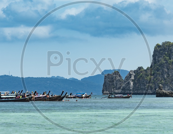 Beautiful View Of Tourists Boats Anchored In Krabi beach For Rock Formation Tours