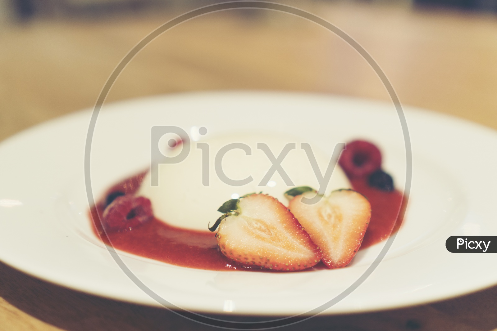 Italian Dessert Panna Cotta With Strawberry  and Jam Served At  a Cafe