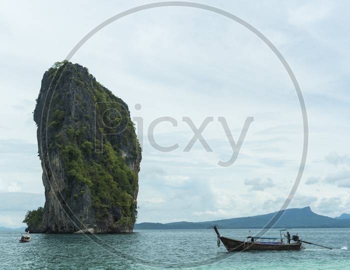 View Of Lime stone Rock Formation on Middle Of Sea From Krabi beach in Thailand