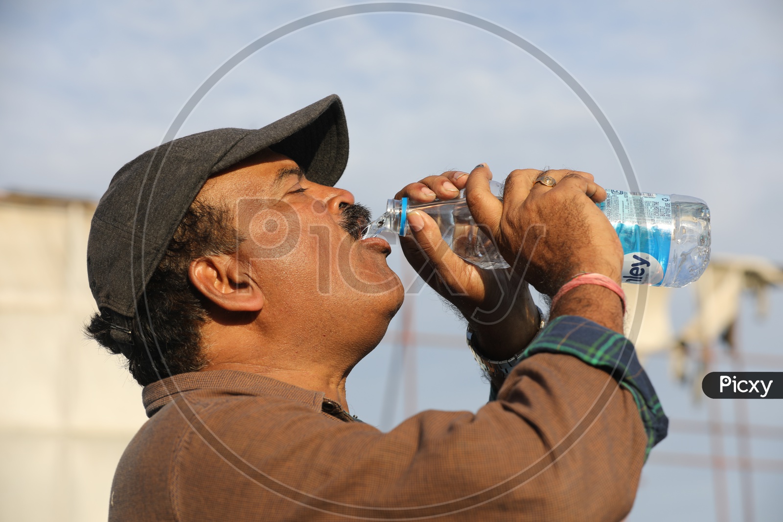 Indian Man drinking water