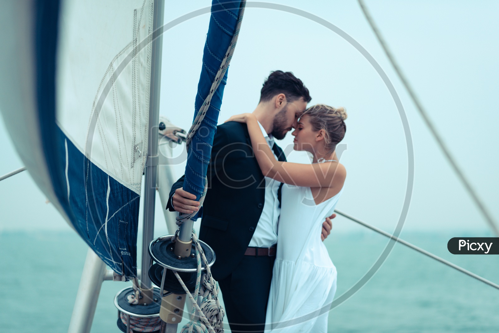 Young Couple Celebrating Wedding Anniversary in a yacht, Honeymoon Trip