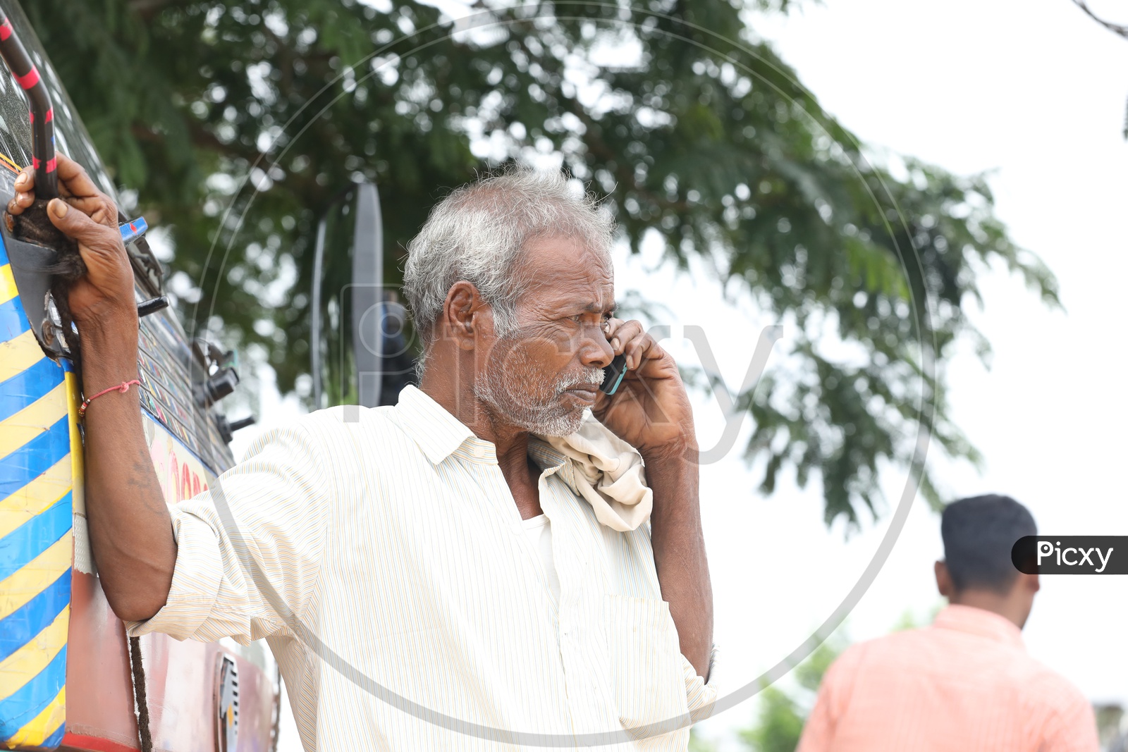 Indian Old Man using cell phone