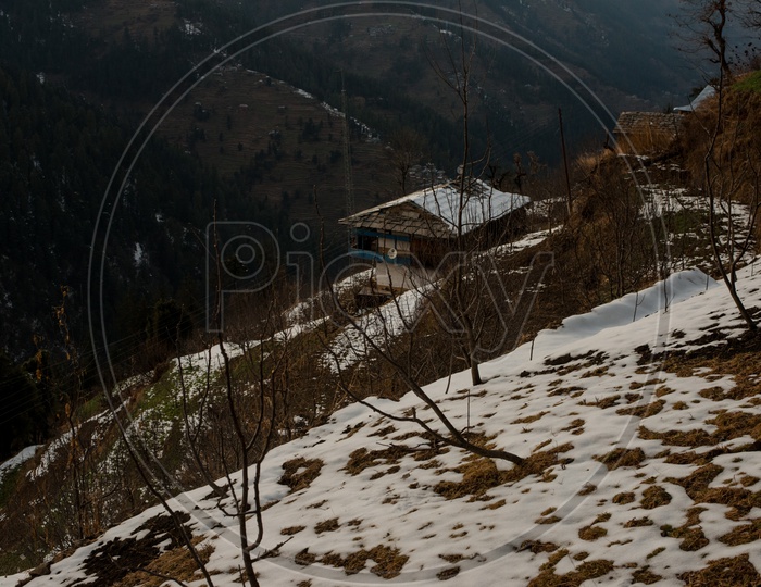 Houses With Snow Falling On Them In Himalayan Mountain  Valleys