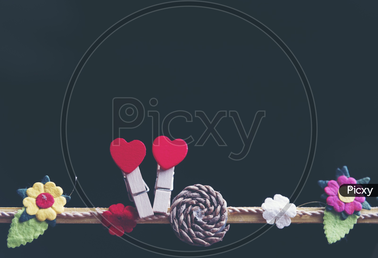 Valentines Day Love Concept With Red hearts Hung On an Isolated Black Background